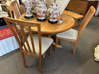 Lot 735 - Round dining table and four chairs