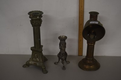 Lot 6 - A brass candle stand together with two further...