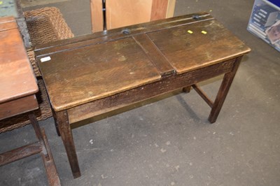 Lot 788 - A stained pine two seat flip-top school desk