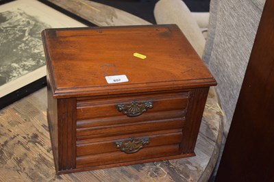 Lot 807 - A two drawer table top chest