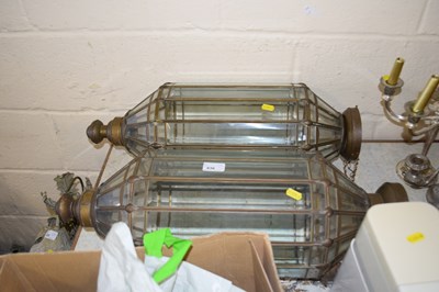 Lot 836 - A pair of metal and glass hanging lanterns