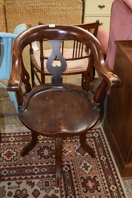 Lot 249 - An early 20th Century blow back offic chair