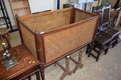 Lot 283 - A Victorian cane sided cot