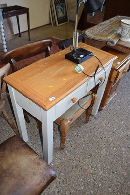 Lot 286 - A light oak dressing table and stool