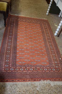 Lot 264 - A modern Middle Eastern machine made floor rug...