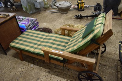 Lot 1044 - Wooden garden lounger with cushion