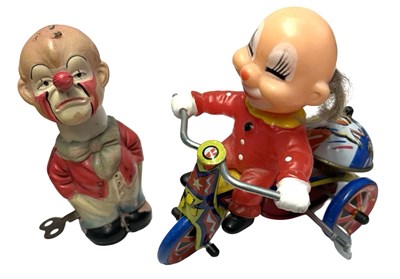 Lot 278 - A pair of vintage tin and plastic mechanical...