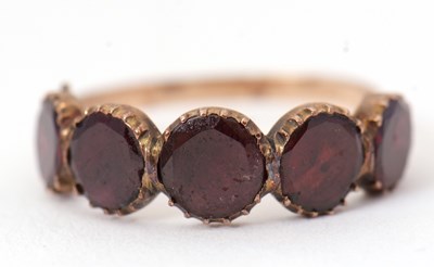 Lot 19 - A 19th century garnet ring, the upper half set...