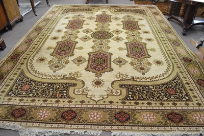 Lot 690 - A large 20th Century deep pile floor rug,...