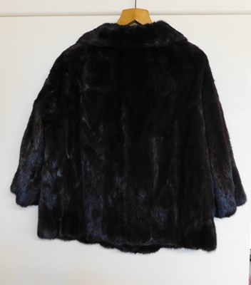 Lot 101 - A lady's brown fur jacket, with hook fastening...