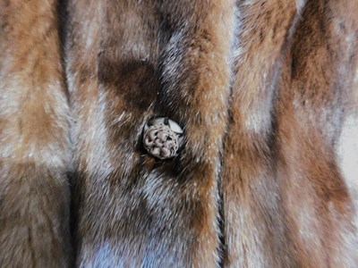 Lot 101 - A lady's brown fur jacket, with hook fastening...