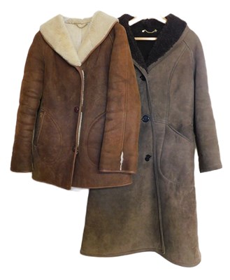 Lot 70 - Two sheepskin coats, both single breated with...