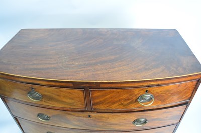 Lot 290 - Late Georgian mahogany bow front chest of two...