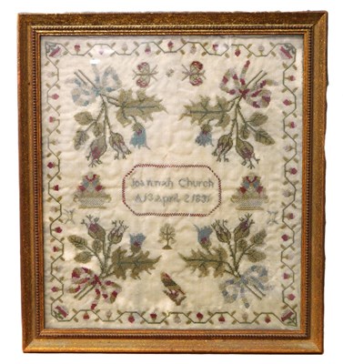 Lot 184 - An early Victorian sampler, with floral motifs...