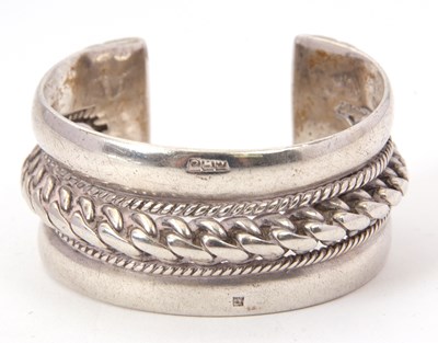 Lot 188 - A silver bangle, the broad bangle, with a...