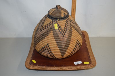 Lot 23 - An African leather dish with mesh border...