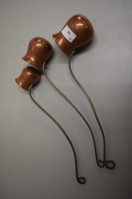 Lot 50 - Three copper ladles one marked Brandy, the...