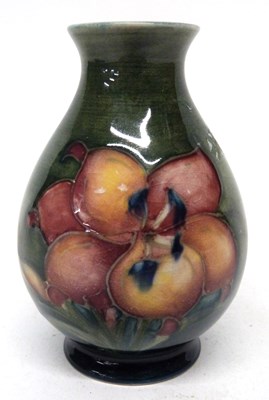Lot 122 - Small Moorcroft baluster vase decorated with...
