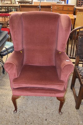 Lot 255 - An upholstered fire side chair