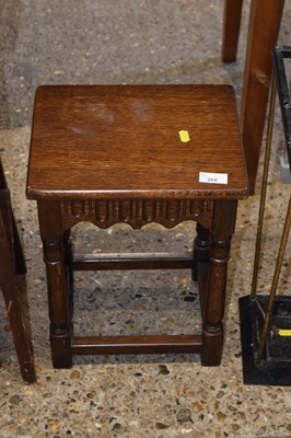 Lot 268 - A small jointed side table with carved decoration