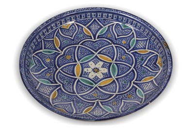 Lot 94 - An Iznik charger with a geometric design on a...