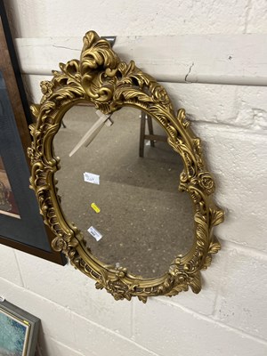 Lot 247 - A plaster framed wall mirror in the Georgian...