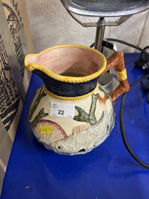 Lot 22 - Ceramic jug depicting fish and aquatic sea...