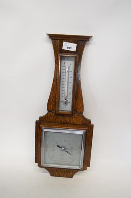 Lot 192 - Early 20th century oak cased aneroid barometer...