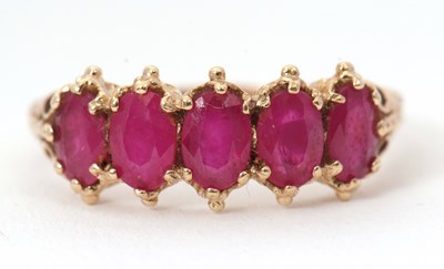 Lot 34 - A 9ct five stone ruby ring, the five slightly...