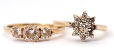 Lot 30 - An 18ct diamond ring and a 9ct CZ ring; the...