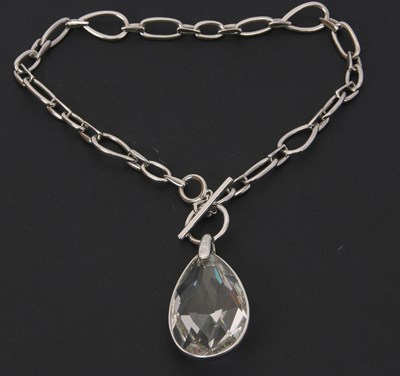 Lot 182 - A Swarovski crystal pendant necklace, the pear...