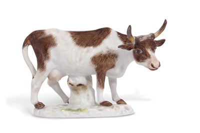 Lot 61 - A Meissen model of a cow on shaped oval base,...