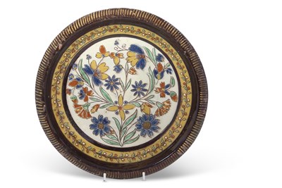 Lot 70 - An unusual pottery dish with Iznik design to...