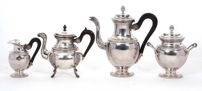 Lot 324 - A four piece French Empire style silver...