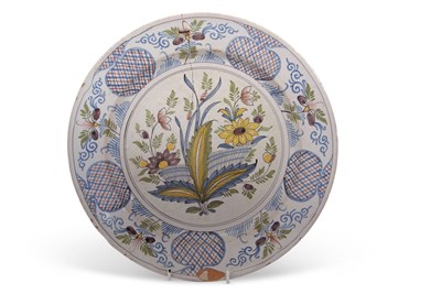 Lot 76 - An 18th Century English Delft charger with a...