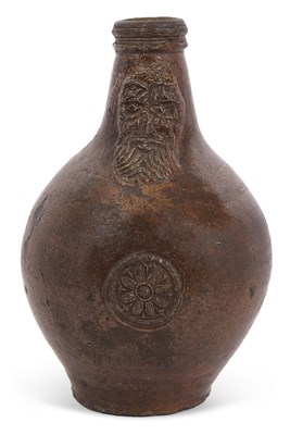 Lot 90 - A 17th Century Bellarmine jug with tiger skin...