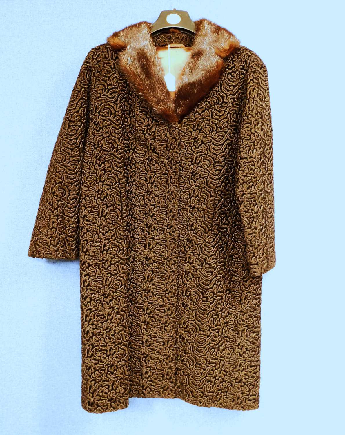 Lot 103 - A brown Astrakhan single breasted coat with...