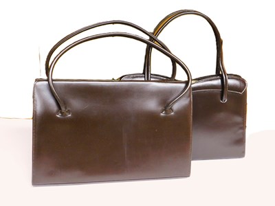 Lot 128 - Two mid 20th Century brown leather handbags to...