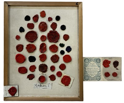 Lot 1184A - A board mounted with various wax seals,...