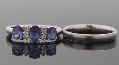 Lot 63 - An 18ct white gold tanzanite and diamond ring,...