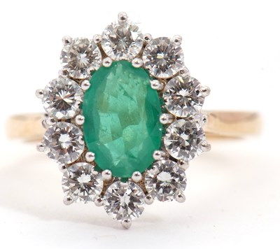 Lot 4 - An 18ct emerald and diamond ring, the central...