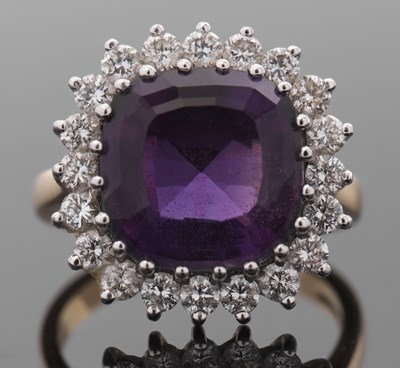 Lot 425 - An 18ct amethyst and diamond ring, the cushion...