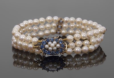 Lot 417 - A sapphire and cultured pearl bracelet, the...