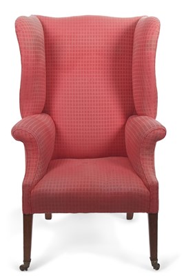 Lot 562 - A large Georgian style wingback armchair...