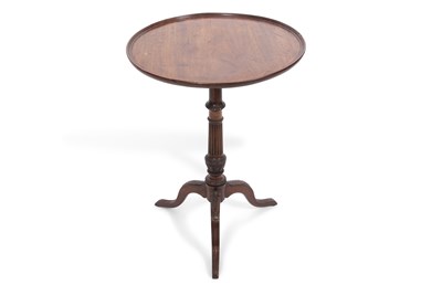 Lot 569 - A Georgian mahogany wine table with circular...