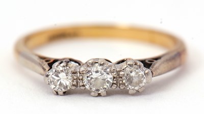 Lot 64 - A three stone diamond ring, set with three...