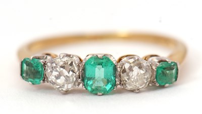 Lot 56 - An emerald and diamond ring, the alternating...