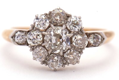 Lot 55 - A diamond cluster ring, set to centre with an...