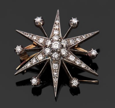 Lot 393 - A diamond star brooch, the diamond set six...