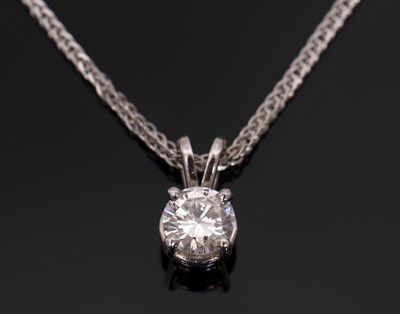 Lot 429 - A diamond solitaire pendant, the round...